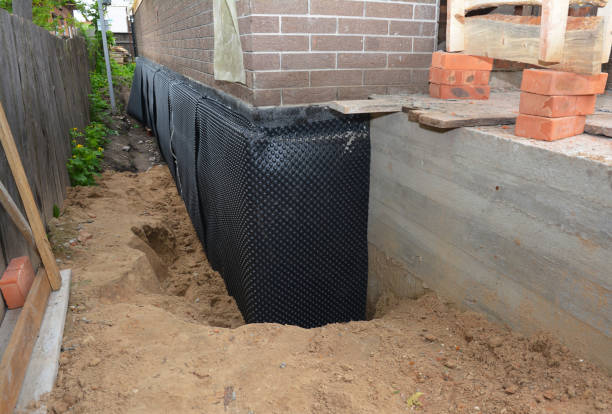 Happy homeowners after waterproofing job in Wellston